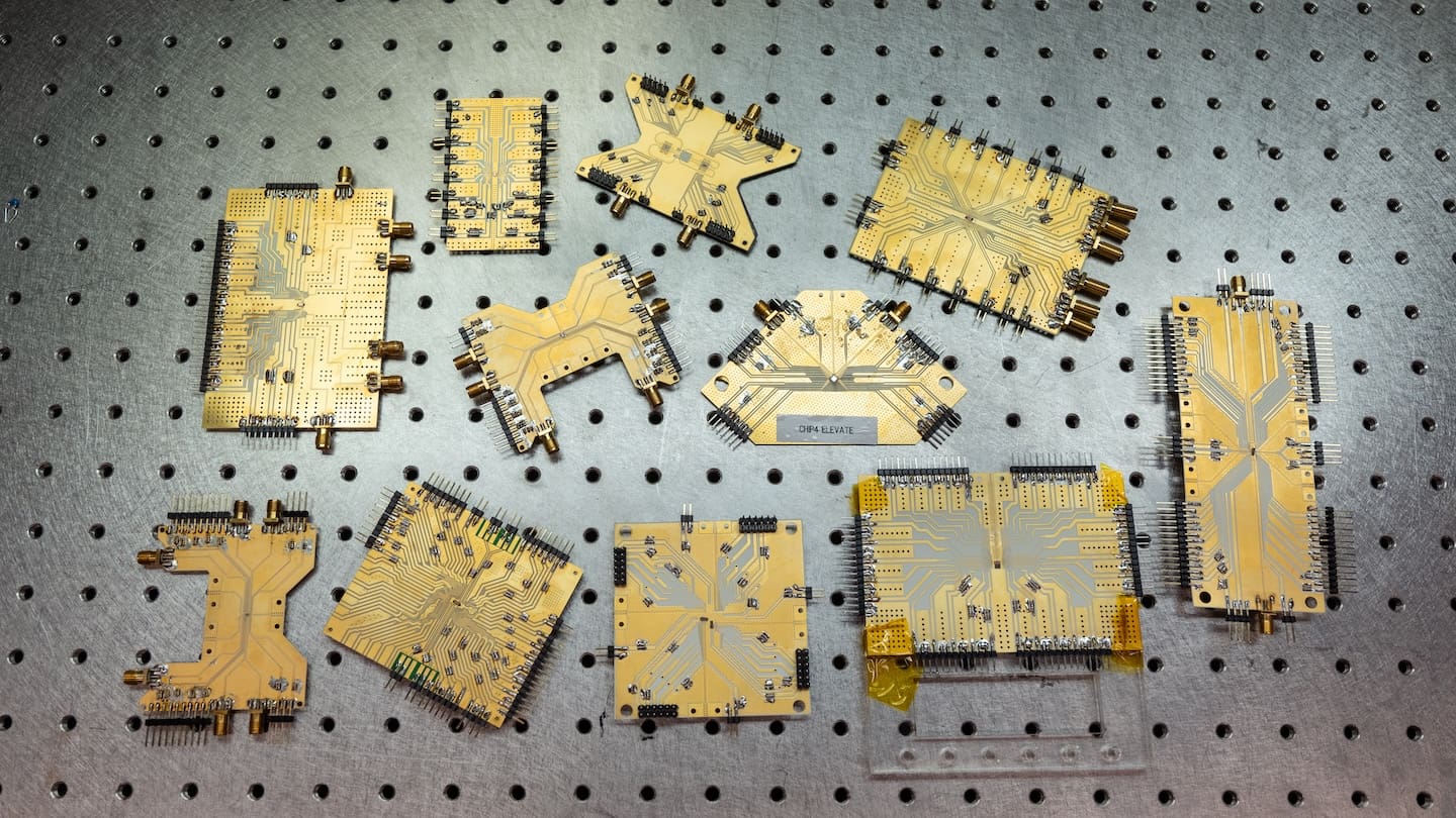 An assortment of advanced microchips on a lab table.